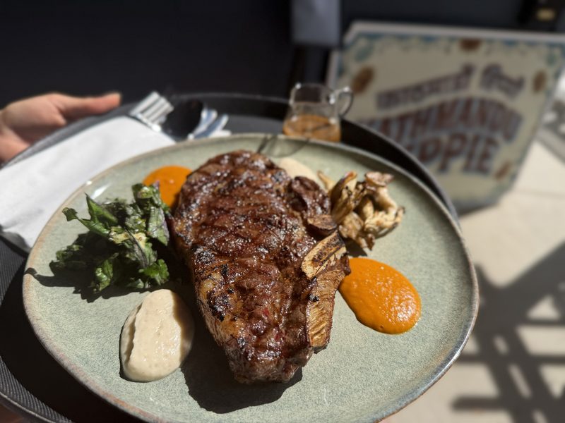 Grilled steak with roasted tomato achar